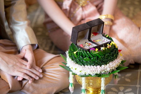 Betrothal and wedding rings / Traditional Thai wedding. - (Selective focus)の写真素材