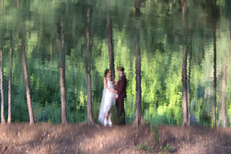 A reflection of couple in water. - Bride and groom pre-wedding.の写真素材