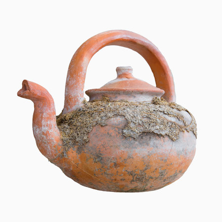 Old clay teapot on isolated white background. - Shallow of focusの写真素材
