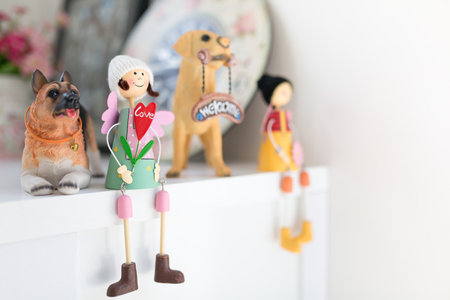 Girls and puppy dolls on a white table, home decorative with copy space.の写真素材