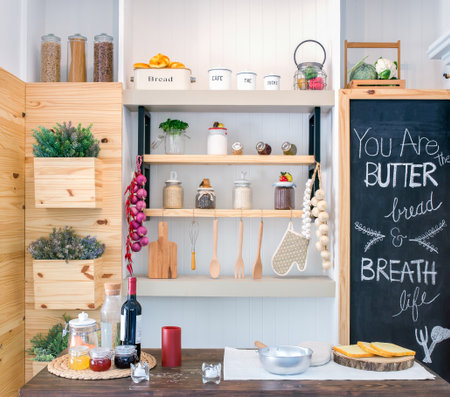 Kitchen shelves with various food ingredients and utensils.の写真素材