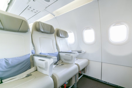Interior of empty ready to fly airliner cabin with rows of seats.の写真素材