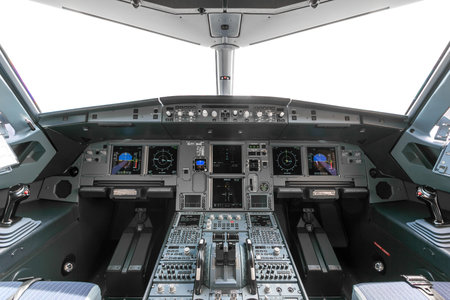 A view of the cockpit of a large commercial airplane a cockpit trainer. Cockpit view of a commercial aircraft cruising Control panel in a plane cockpit.の写真素材
