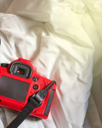 Camera on a bed in the morning.