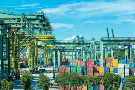 Logistics and transportation of International Container Cargo ship and cargo plane in the ocean at twilight sky Freight Transportation Shipping in Singapore.のeditorial素材