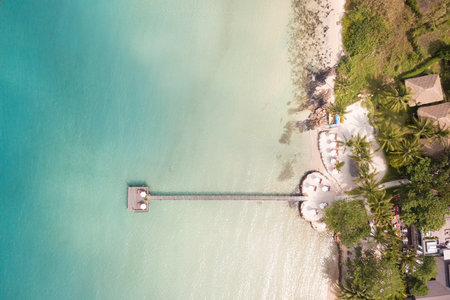 Aerial view of beautiful tropical resort beach with wooden pier into the sea.の写真素材