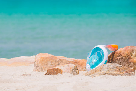 Goggles or mask for snorkeling or swimming on the beach at sunny day. selective focus shot.の写真素材