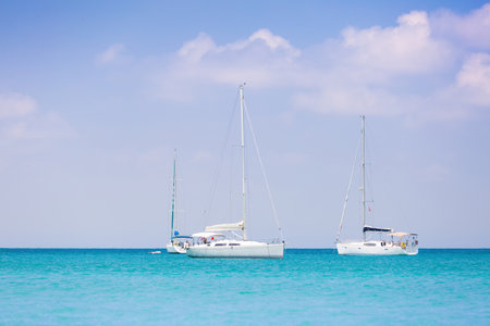 Sailing. Ship yachts with white sails in the Sea. Luxury boats. Boat competitor of sailing regatta.の写真素材