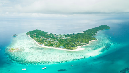 Aerial view of beautiful tropical beach in Satun, Thailand. Lipe island is the Thai island in the Andaman Sea. Which is populated with small islands and known for its coral-rich waters.の写真素材