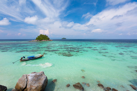 Aerial view over group of long tail boats with beautiful sea and beachTop view from drone Koh Lipe island, Satun Province, Thailand.の写真素材