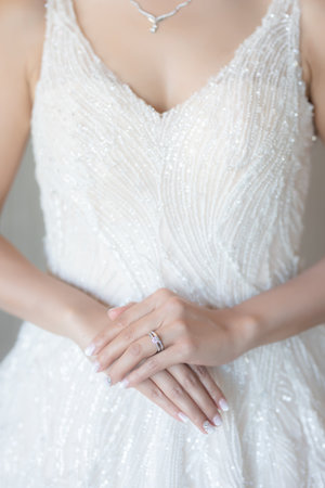 Hand coordinate of beautiful asian woman bride with engagement ring on her finger,Ceremony in wedding day,Happy and smiling.の写真素材
