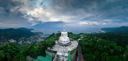Aerial view during sunset of Phuket Big Buddha, or The Great Buddha of Phuket, is a seated Maravija Buddha statue in Phuket, Thailand.の写真素材