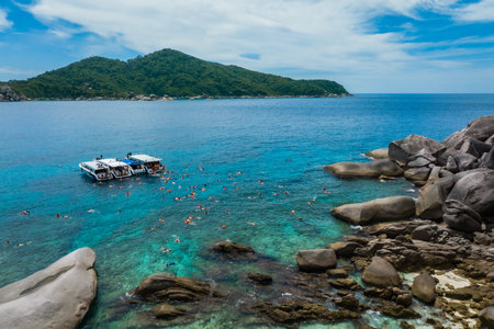 Aerial view over one of Similan island and it's shape look like heart in sea with green tree forest and blue or turquoise color in Thailand.の写真素材