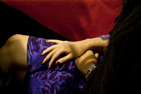woman s hands on a purple dressの写真素材