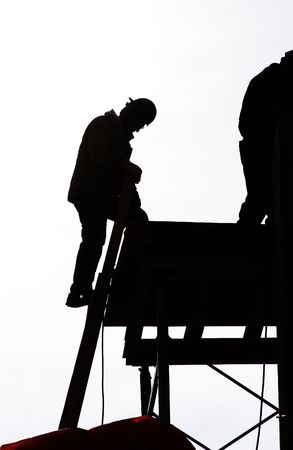 silhouetted construction workerの写真素材
