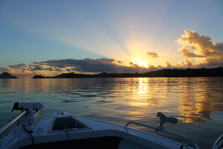Colorful sunrise on a beautiful still morning fishing in Australiaの写真素材
