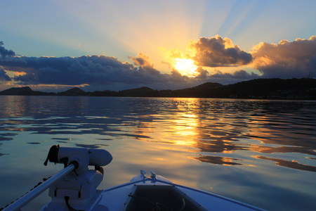 Colorful sunrise on a beautiful still morning fishing in Australiaの写真素材