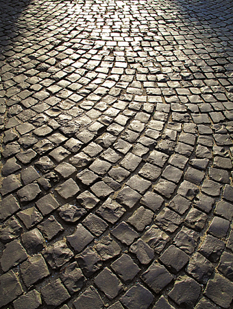 Cobble stone street background at sunset, Italyの写真素材
