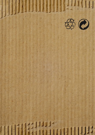 Cardboard brown paper texture background with recycling signsの写真素材