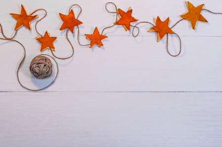 Holidays background with hand made decorations on wooden boardの写真素材