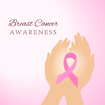 Hands holding pink breast cancer awareness ribbonの写真素材