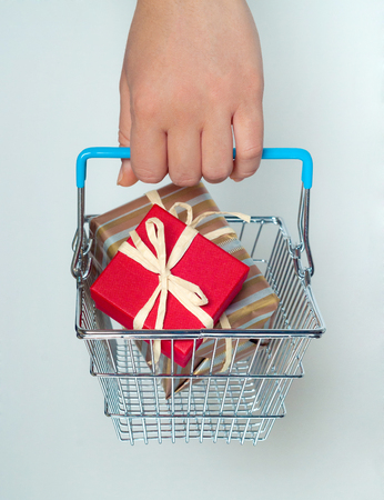 A shopping cart with giftboxes, sale conceptの写真素材