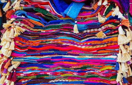 Colorful rugs piled up at the market in Moroccoの写真素材