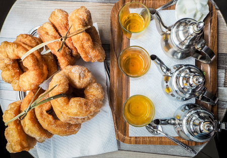 Traditional fresh baked donuts with tea in Moroccoの写真素材