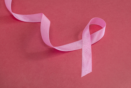 Breast cancer concept, pink ribbon on backgroundの写真素材