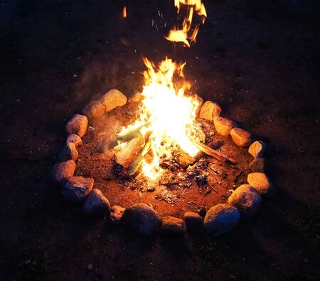 Bonfire in the night, outdoor camping in summer with guitarの写真素材