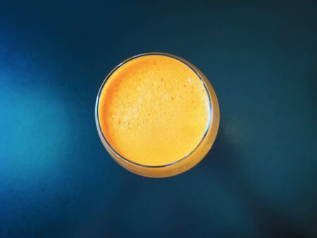 A glass of healthy carrot juice on the tableの写真素材