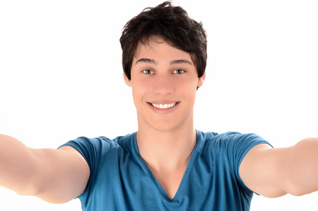  Man smiling with hands reaching out  Happy young man taking a selfie photoの写真素材