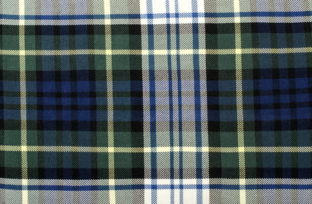 Scottish tartan pattern. Blue and green with white plaid print as background. Symmetric square...