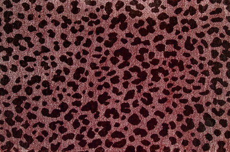 Red leopard pattern. Spotted animal print as background.