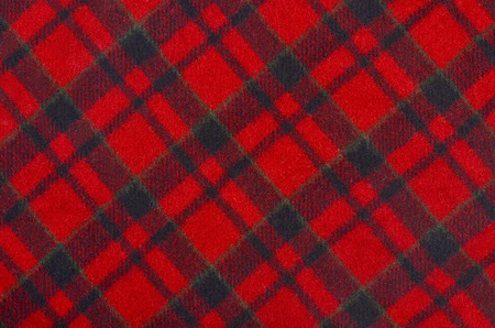 Scottish tartan pattern. Red and black wool plaid print as background. Rhombus pattern.の写真素材