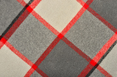 Scottish tartan pattern. Red and grey wool plaid print as background. Rhombus pattern.の写真素材