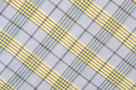 Blue and yellow plaid print as background.の写真素材