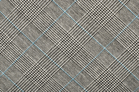 Black and white with blue houndstooth pattern in squares. Black and white wool twill pattern. Woven dogstooth check design as background.の写真素材