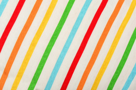 Colorful striped background. Diagonal stripes pattern on white fabric.の写真素材