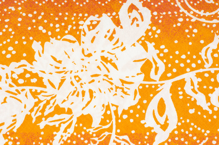 Flowers and shapes on colorful fabric. Abstract flower and geometric shapes print as background.の写真素材