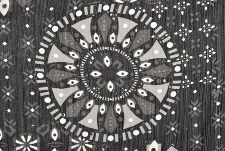 Circle and shapes on black fabric. Abstract monochrome geometric shapes print as background.