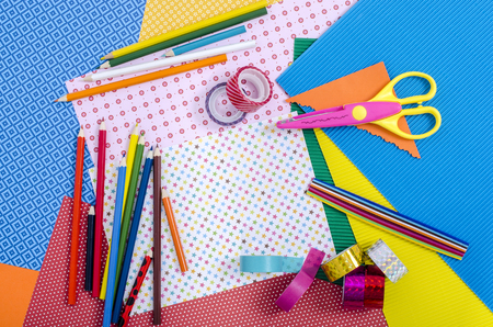 Arts and craft supplies. Color paper, pencils, different washi tapes, craft scissors.の写真素材