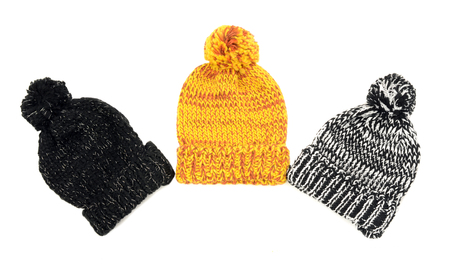 Three cute winter hats. Winter accessories isolated on white background.の写真素材