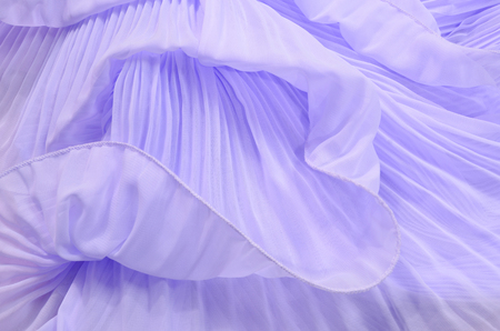 Close up on purple pleated lace. Pastel violet crumpled tulle as background.の写真素材