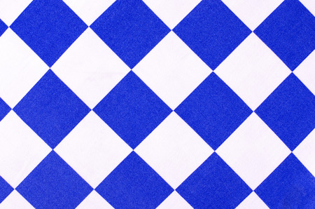 White and blue chequer  background. Checker diamond shape pattern on fabric.の写真素材