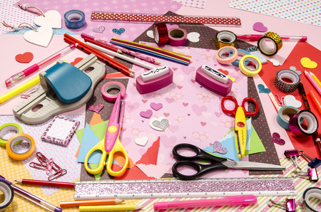 Arts and craft supplies for Saint Valentine's.  Color paper, pencils, different washi tapes, craft scissors, hearts supplies for decoration.の写真素材