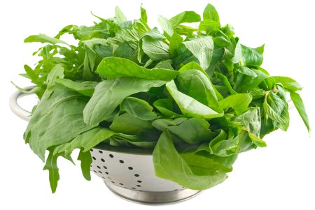 vegetable in colander isolated on white backgroundの写真素材