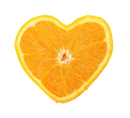 Orange cross section shaped like heart on white backgroundの写真素材