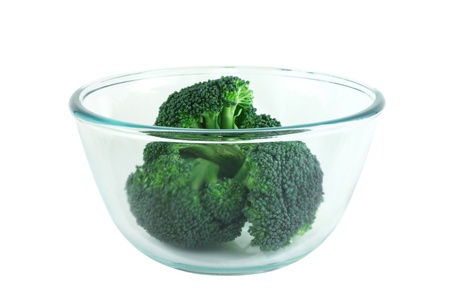 Fresh broccoli pieces in transparent bowl isolated on white backgroundの写真素材