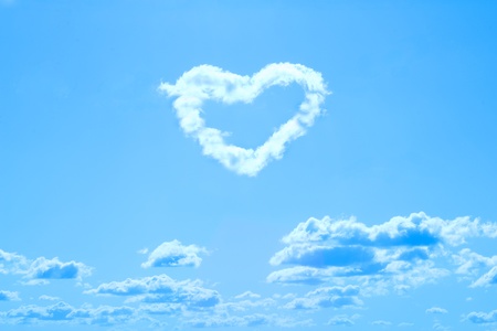 cloud shaped like heart on blue skyの写真素材